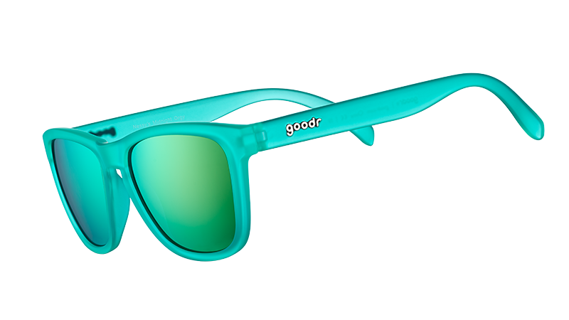 Three-quarter angle view of square-shaped teal sunglasses with teal reflective polarized lenses.