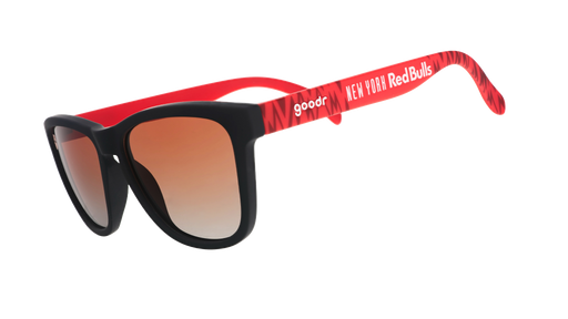 Three-quarter angle view of MLS New York Red Bulls shades tilted down. Red+black frames. Orange+gold gradient lenses.