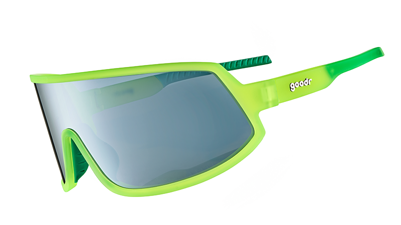 Three-quarter angle view of wraparound sunglasses with a gray reflective lens & neon yellow frame & green inner grips. 