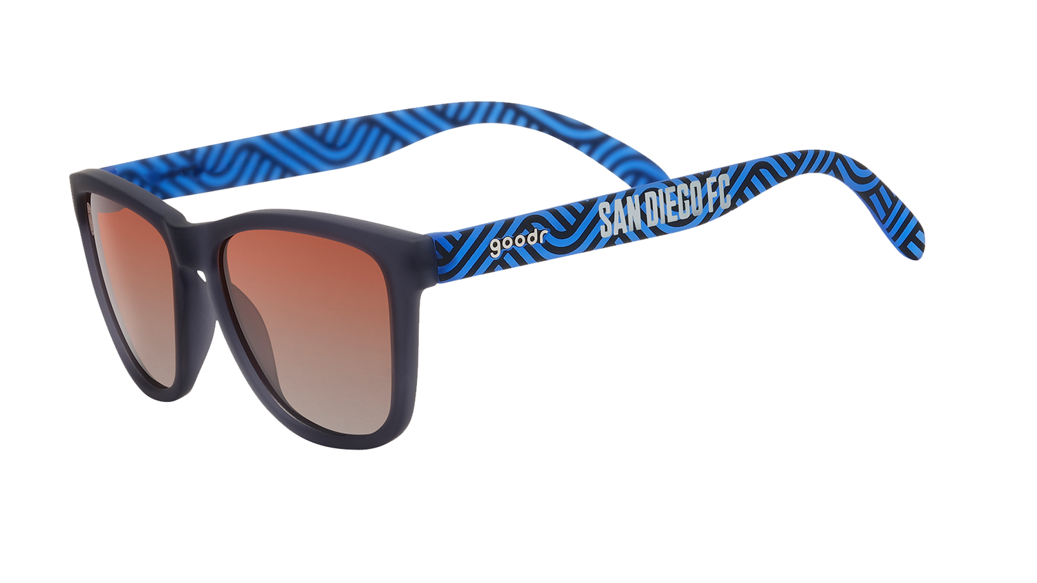 Angled view of shades tilted down. Dark gray frames w/ blue waves, San Diego FC on temples+orange gold gradient lenses.