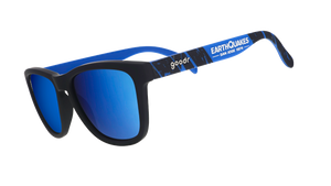 Three-quarter angle view of MLS San Jose Earthquakes shades tilted down. Black+blue frames. Blue reflective lenses.