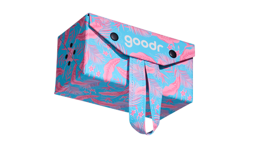 Three-quarter angle view of a rectangular hard cloth sunglasses case shot from below. The case features a tropical pink and blue fabric design.