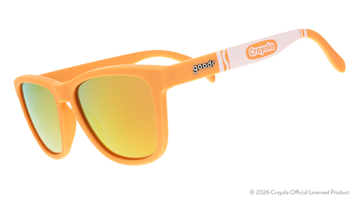 Three-quarter angle view of tan sunglasses w/ white Crayola marker pattern + amber reflective lenses tilted down.