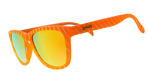 Three-quarter angle view of limited-edition salmon-patterned sunglasses with amber reflective polarized lenses.