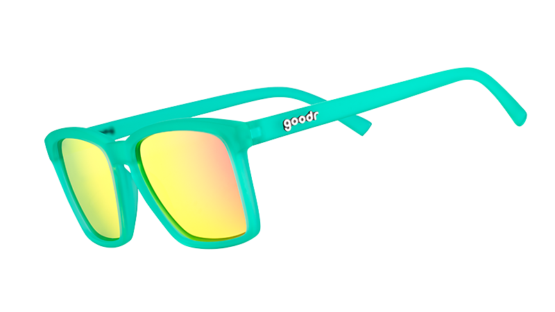 Three-quarter angle view of small square-shaped teal sunglasses with pink reflective mirrored lenses.