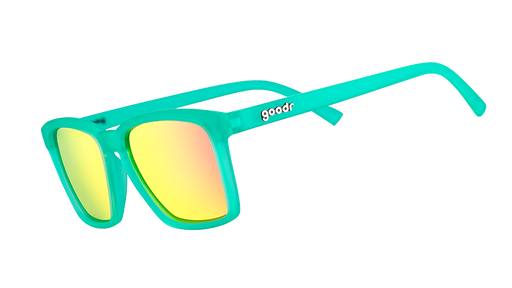 Three-quarter angle view of small square-shaped teal sunglasses with pink reflective mirrored lenses.