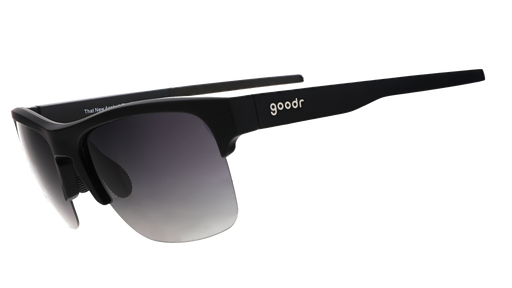 Three-quarter angle view of black half-rim sunglasses with a dual-lens wrap and polarized black gradient lenses and black silicone grips on the inner right arm.