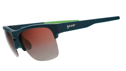 Three-quarter angle view of solid green half-rim sunglasses featuring polarized rose gradient lenses and lime green silicone grips on the inner right arm.