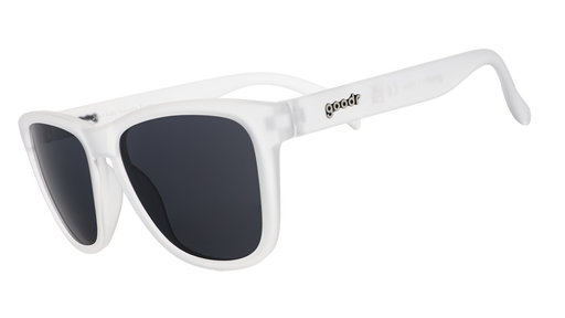 Three-quarter view of a pair of clear sunglasses with black non-reflective lenses in a classic frame shape.