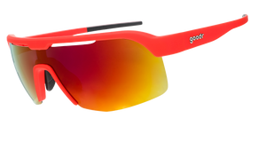 Sports sunglasses with a bright red frame and a wraparound reflective lens with an orange-red gradient.