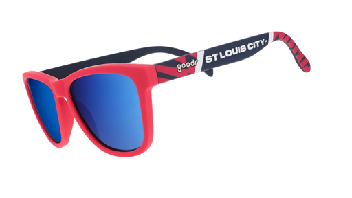 Three-quarter angle view of MLS St. Louis CITY SC shades tilted down. Red+black frames. Blue reflective lenses.