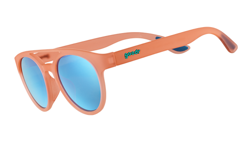 Three-quarter angle view of round orange sunglasses with a double bridge and teal reflective mirrored lenses.