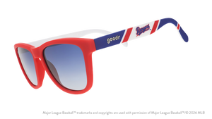 Three-quarter angle view of a pair of red, white, and blue sunglasses featuring the Texas Rangers logo on the arm. 