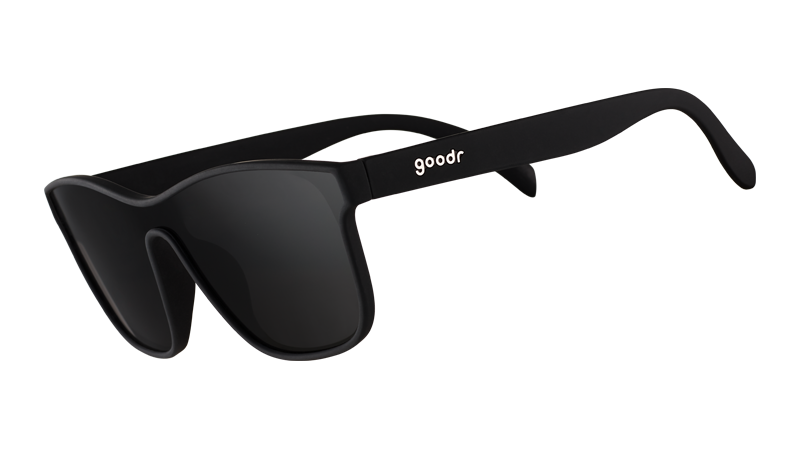 Three-quarter angle view of futuristic-looking black sunglasses with a non-reflective black flat single lens.