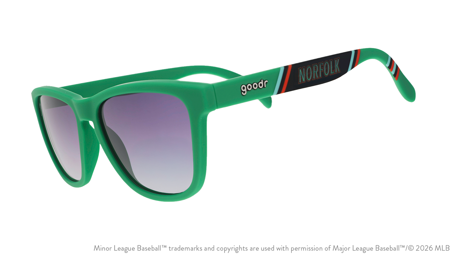 Three-quarter angle view of sunglasses. Green frames w/ a stripe pattern + Norfolk on temples. Black gradient lenses.