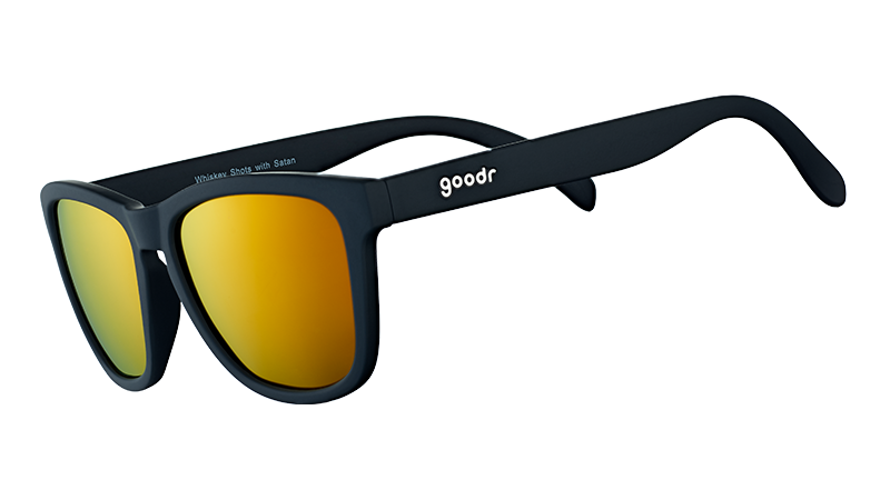 Three-quarter angle view of square-shaped black sunglasses with mirrored amber lenses.