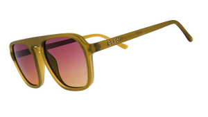 Three-quarter-angle view of translucent dusted ochre Retro G sunglasses with purple-yellow gradient lenses.