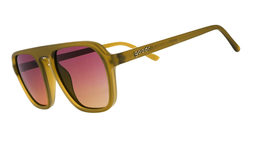 Three-quarter-angle view of translucent dusted ochre Retro G sunglasses with purple-yellow gradient lenses.