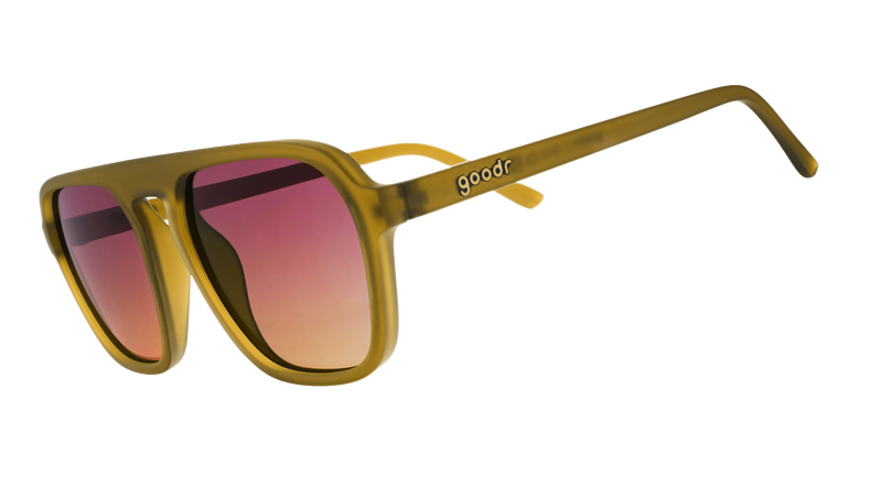 Three-quarter-angle view of translucent dusted ochre Retro G sunglasses with purple-yellow gradient lenses.