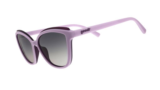 Three-quarter-angle view of lavender cat-eye Pounce G sunglasses with dark purple accents and dark gray gradient lenses. 