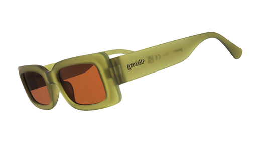 Three-quarter-angle view of rectangular Luxe G sunglasses in translucent olive green with brown non-reflective lenses.