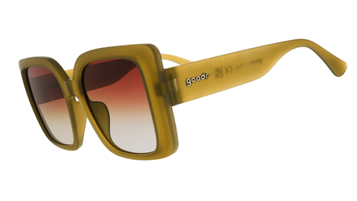 Three-quarter-angle view of translucent, oversized square Amp Gs in a dusted-ochre hue with brown-gray gradient lenses.
