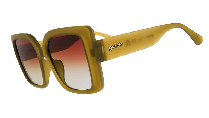 Three-quarter-angle view of translucent, oversized square Amp Gs in a dusted-ochre hue with brown-gray gradient lenses.