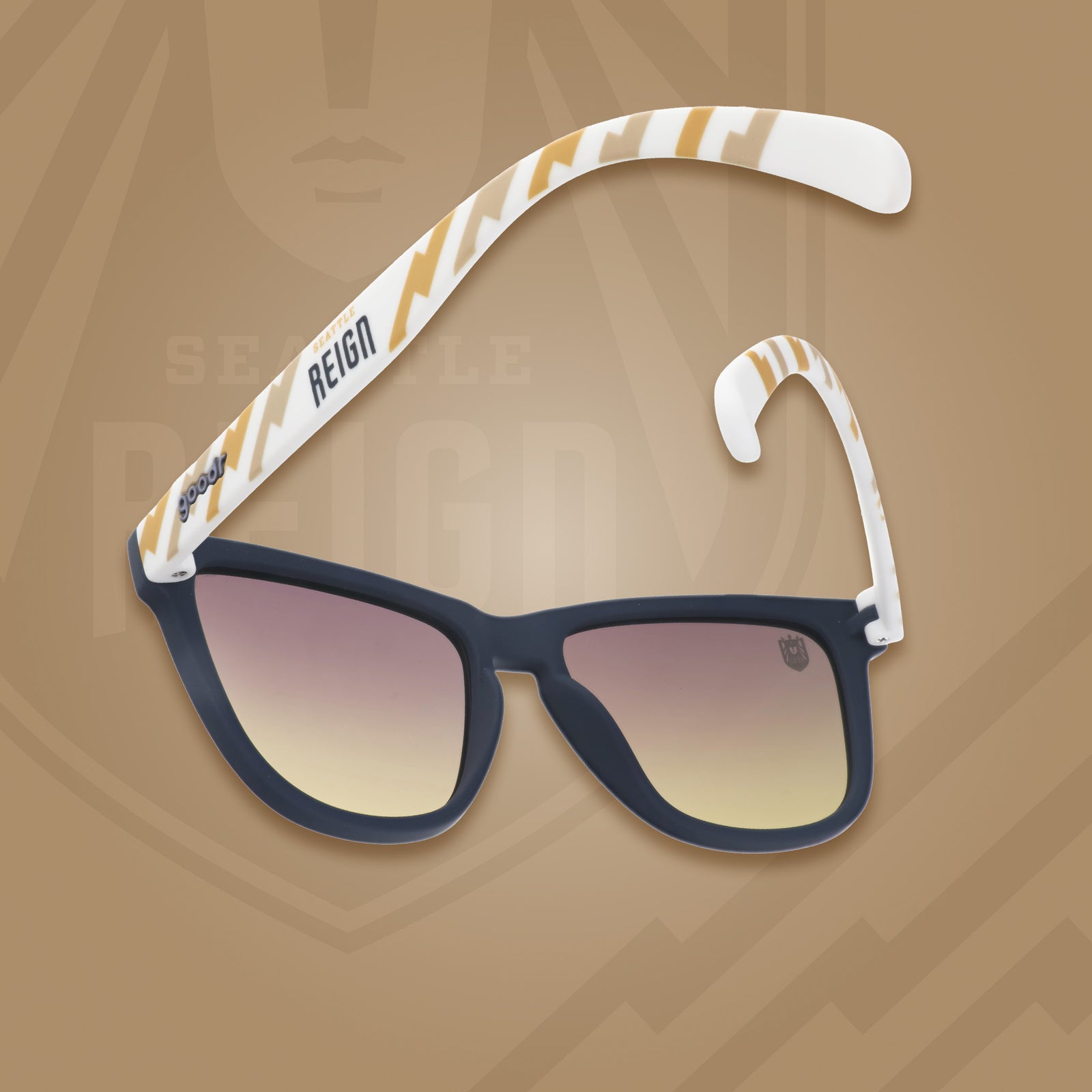 Back view of black and white sunglasses with a golden sunrise pattern, the Seattle Reign logo, and gray-to-yellow ocean gradient lenses.