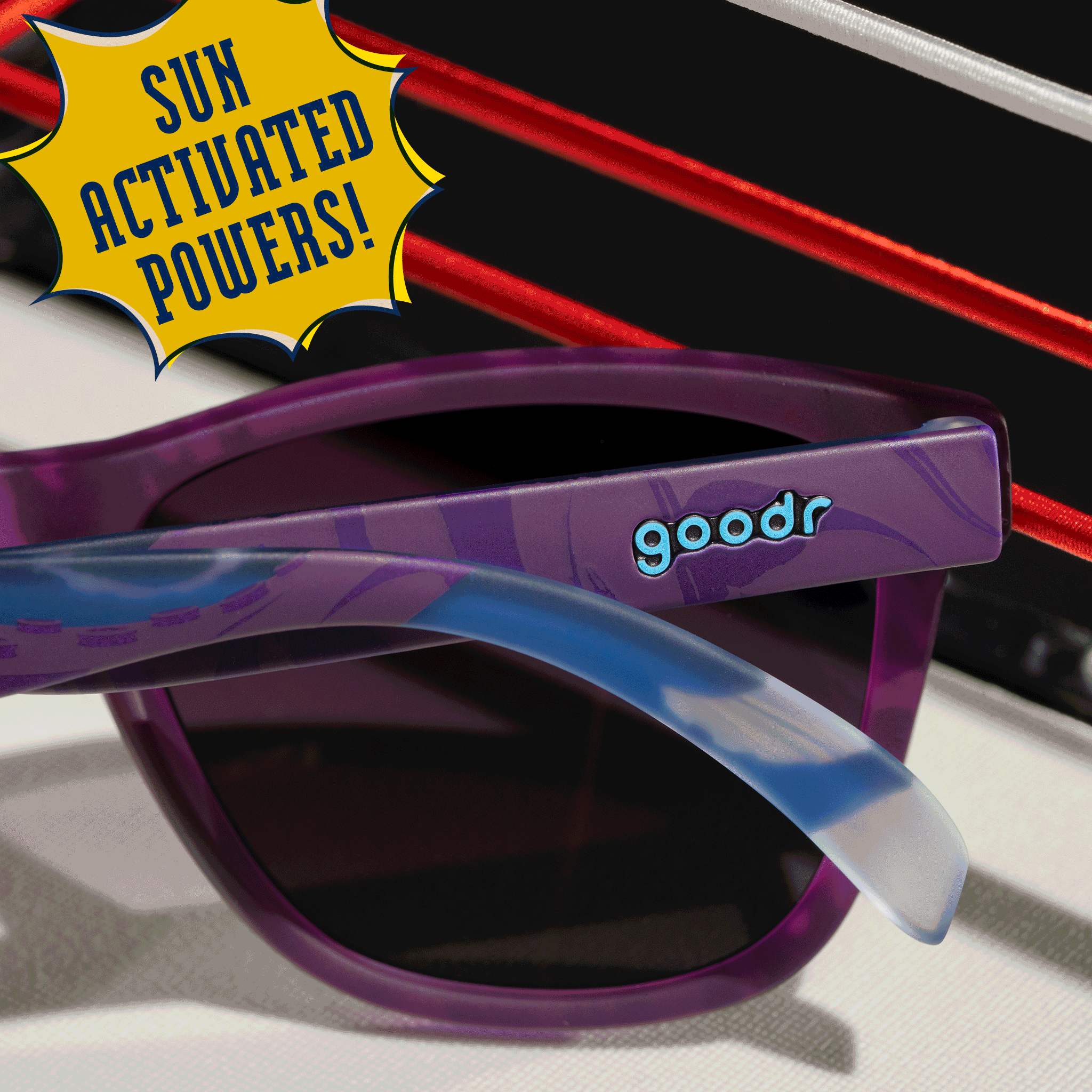 Close-up shot taken from behind of a pair of UV-reactive blue and purple shades with purple gradient lenses.