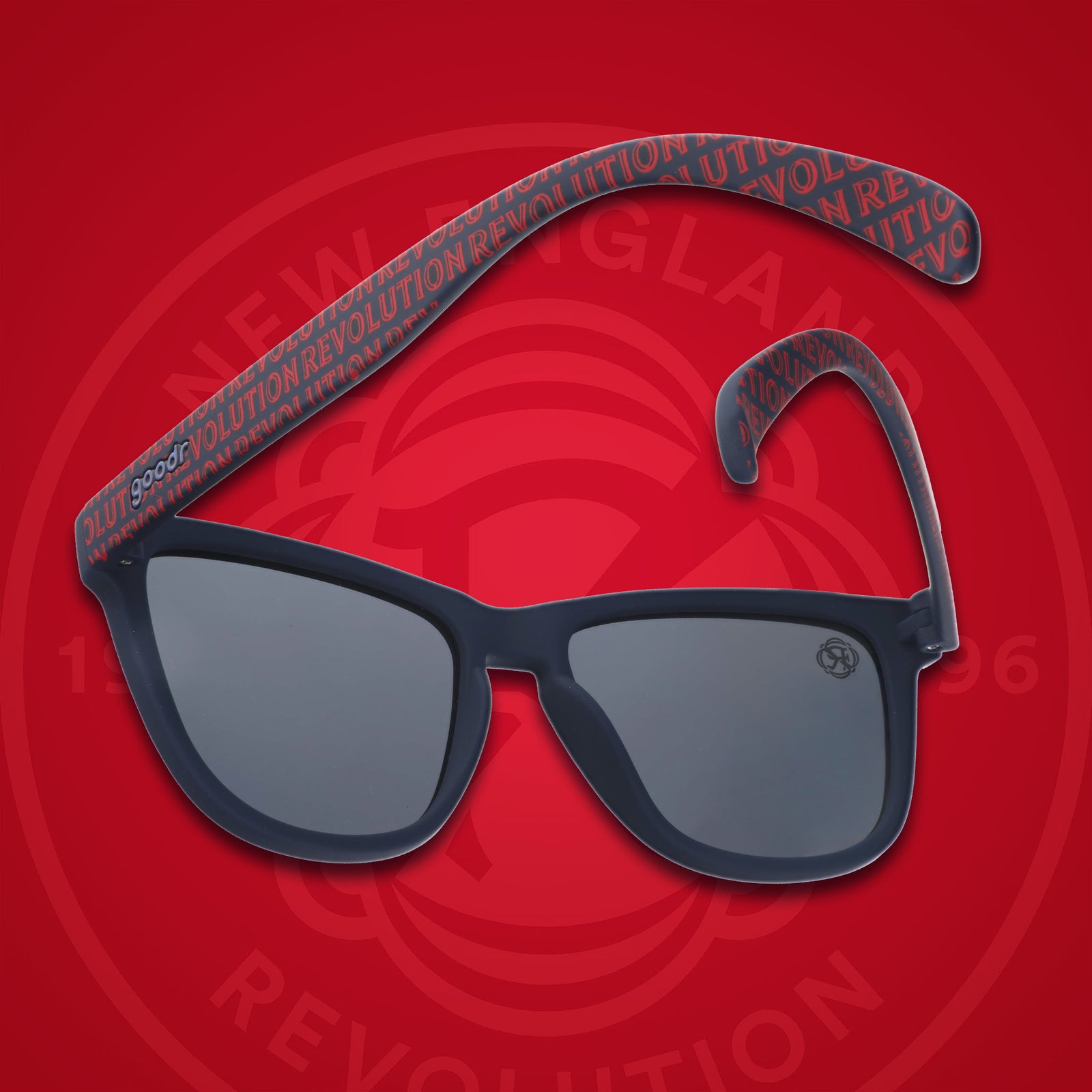 Three-quarter angle back view of MLS New England Revolution shades. Black+red frames. Black non-reflective lenses.