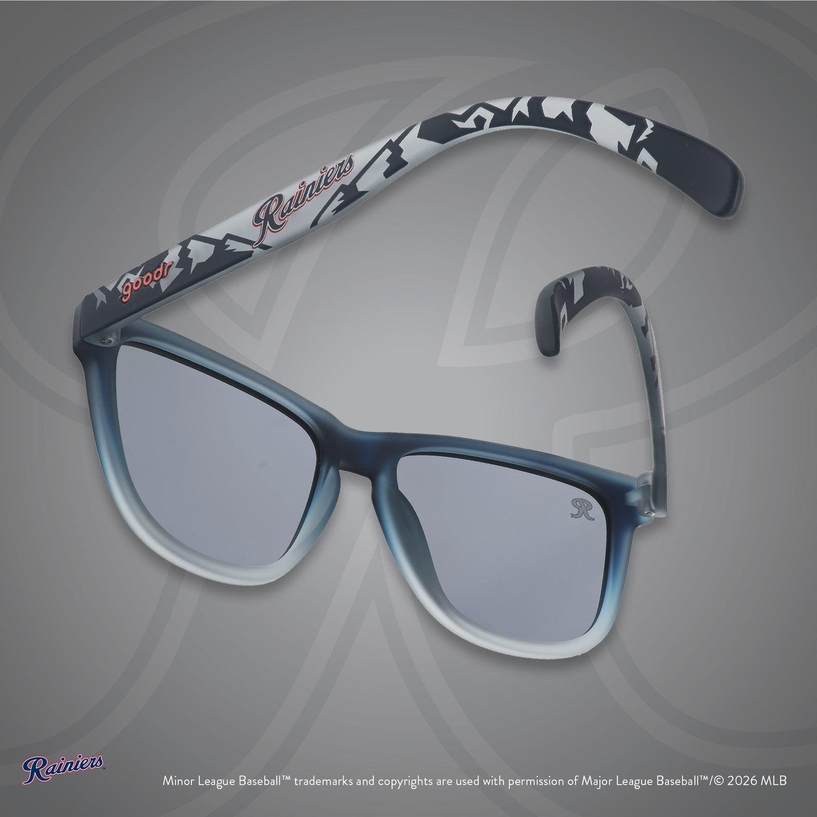 Back view of sunglasses. Gray frames w/ mountain pattern, Rainiers on temples + black non-reflective lenses.