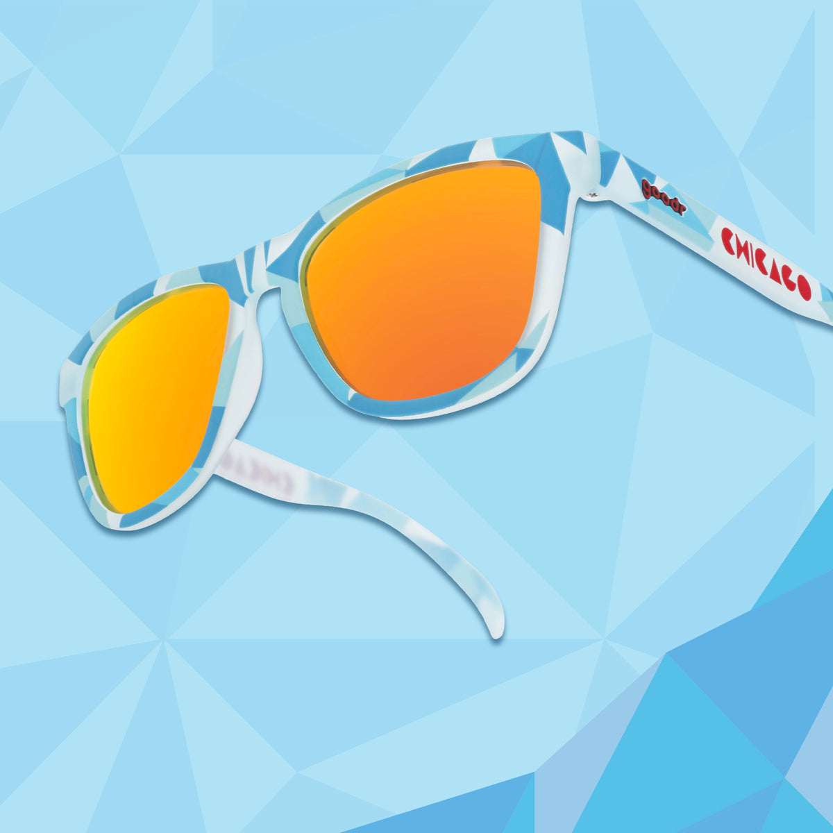 Translucent blue, geometric-patterned sunglasses against a blue geometric background.