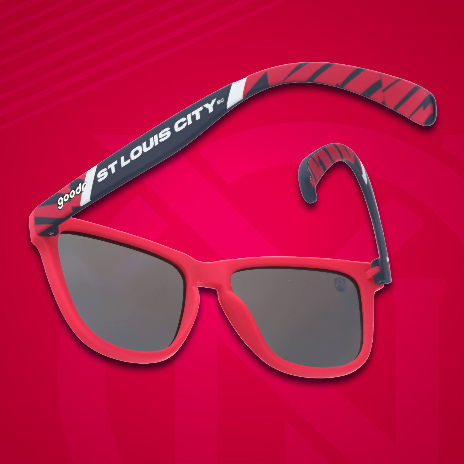Three-quarter angle back view of Major League Soccer St. Louis CITY SC shades. Red+black frames. Blue reflective lenses.