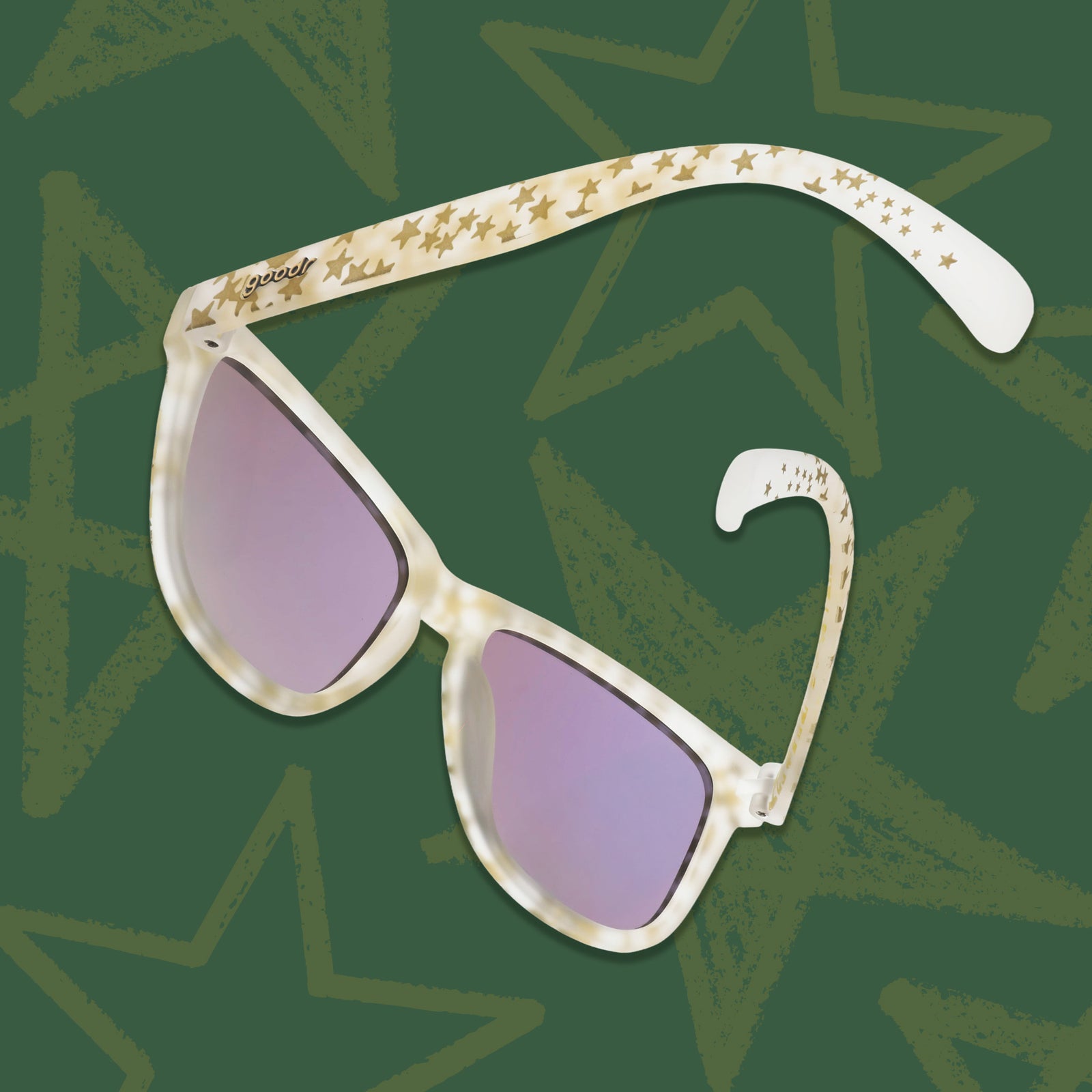 A pair of gold star-adorned sunnies floating against a chalkboard green background with faint gold stars on it.