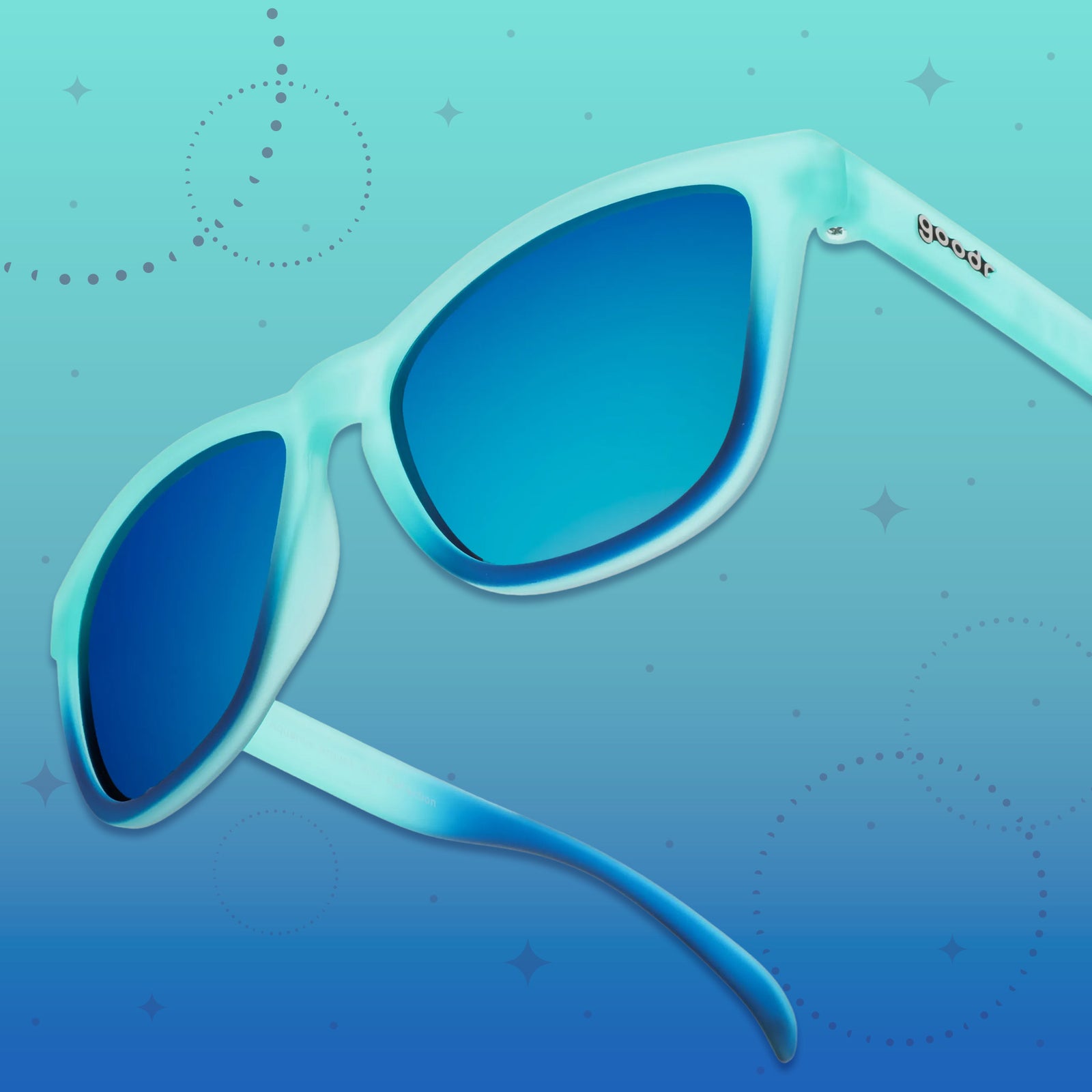 Side view of a pair of turquoise-to-blue ombre OG frames with teal reflective lenses on a blue gradient graphic background.