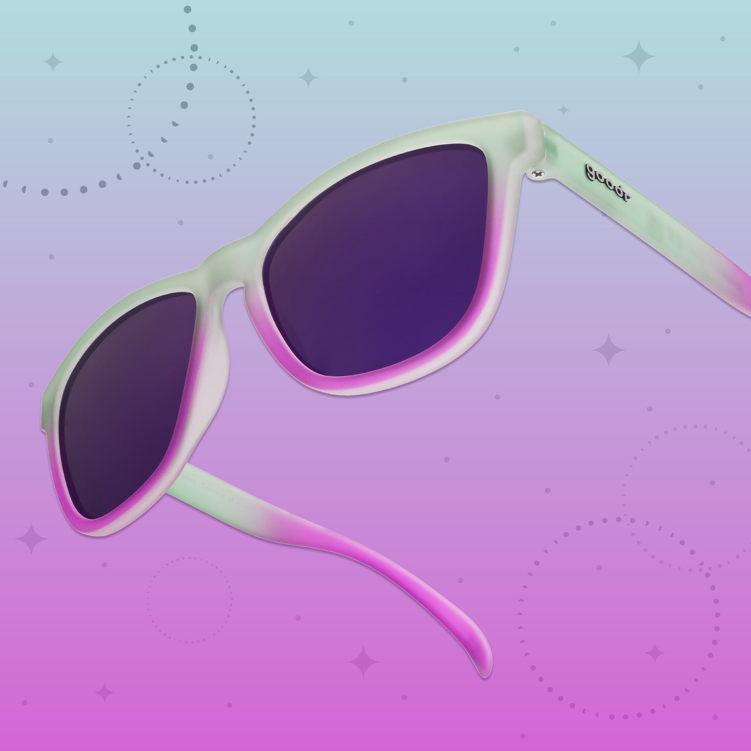 Side view of a pair of light green-to-purple ombre OG frames with purple reflective lenses on a green and purple graphic background.