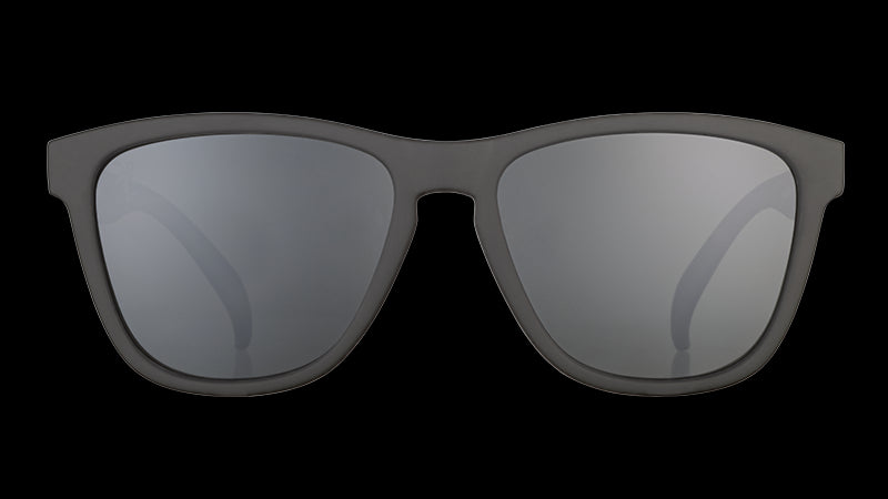 Front view of square-framed black sunglasses with black lenses on a white background.