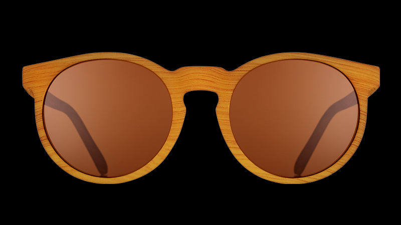 Front view of brown wood grain patterned round sunglasses with circular brown non-reflective lenses.