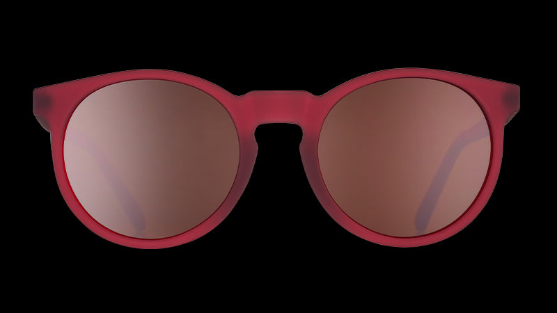 Front view of round burgundy sunglasses with round brown non-reflective lenses.