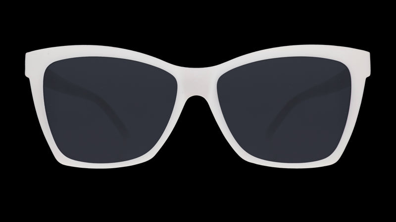 Front view of solid white sunglasses with an angled cat-eye frame and non-reflective black lenses.
