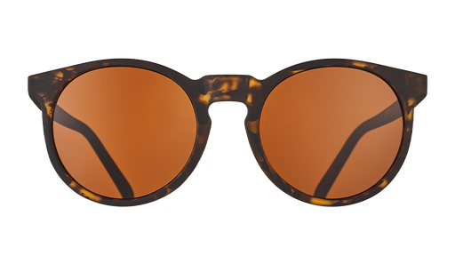Front view of round brown tortoiseshell sunglasses with circle-shaped brown non-reflective lenses.
