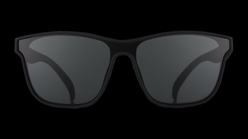 Front view of black sunglasses with a black non-reflective flat single lens.