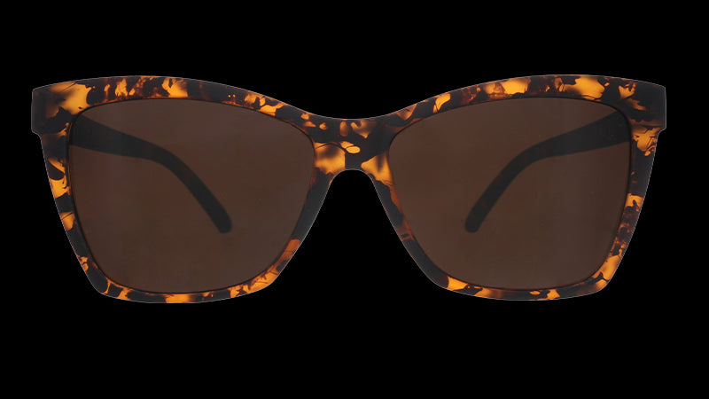 Front view of brown tortoiseshell angled cat-eye sunglasses with non-reflective brown lenses.
