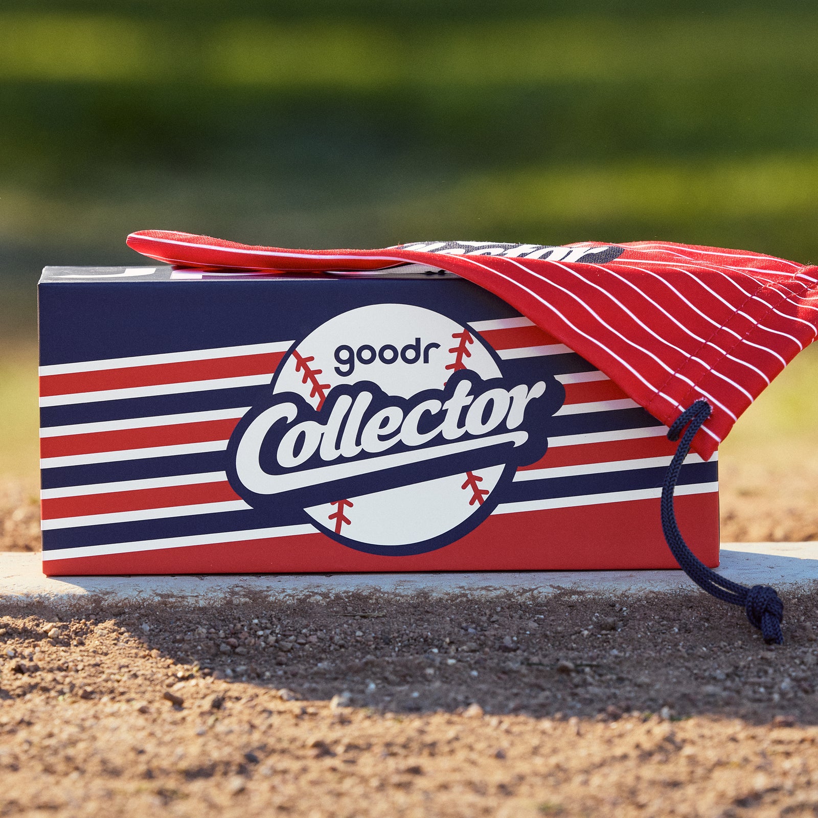 Front view of goodr baseball custom Collector-themed packaging for the sunglasses with a striped microfiber bag and box.