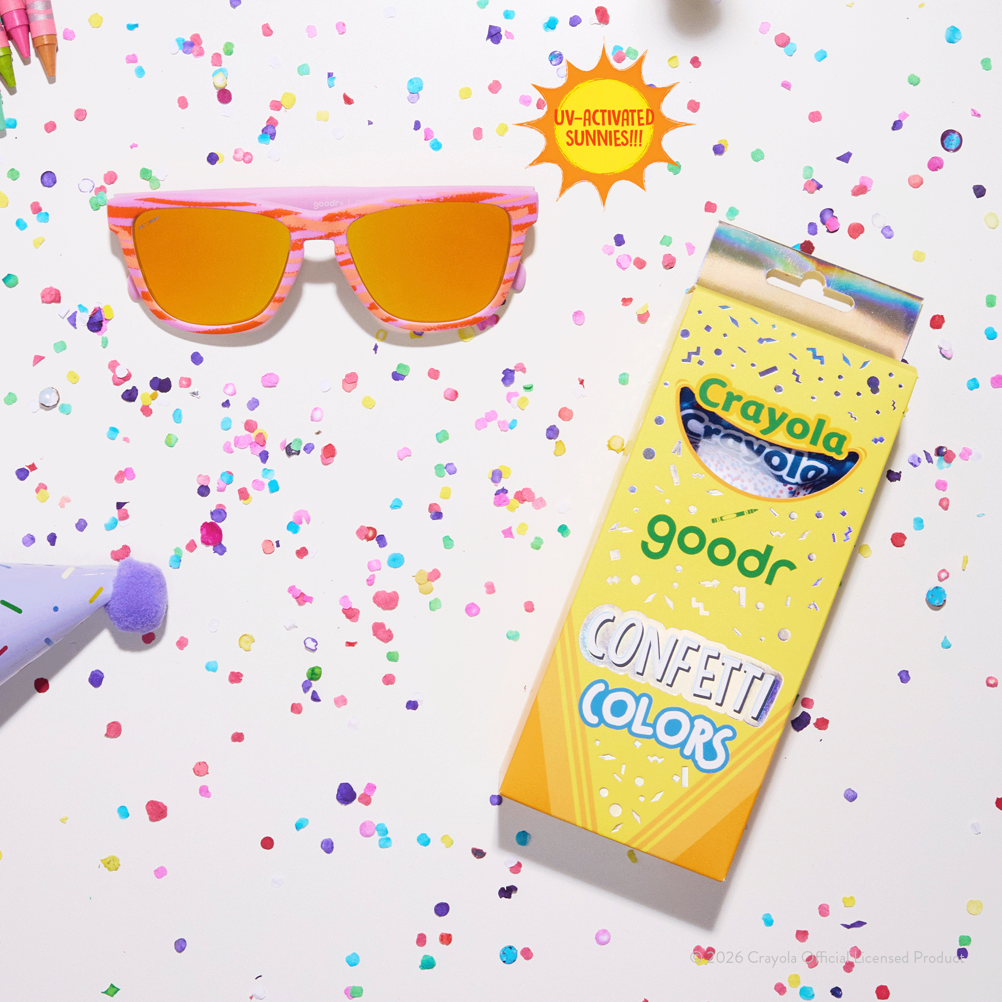 Bone & magenta goodr shades with amber lenses next to Crayola Confetti Colors box, colorful confetti & party supplies.