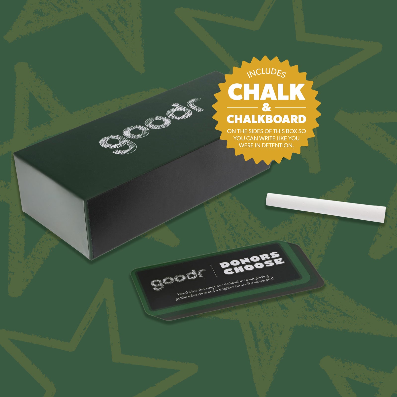 View of custom packaging, including a chalkboard box, chalk, and insert card on a green backdrop with faint gold stars.