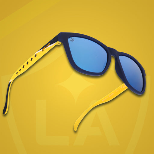 Three-quarter angle front view of MLS LA Galaxy shades on a yellow background. Navy+yellow frames. Blue lenses.
