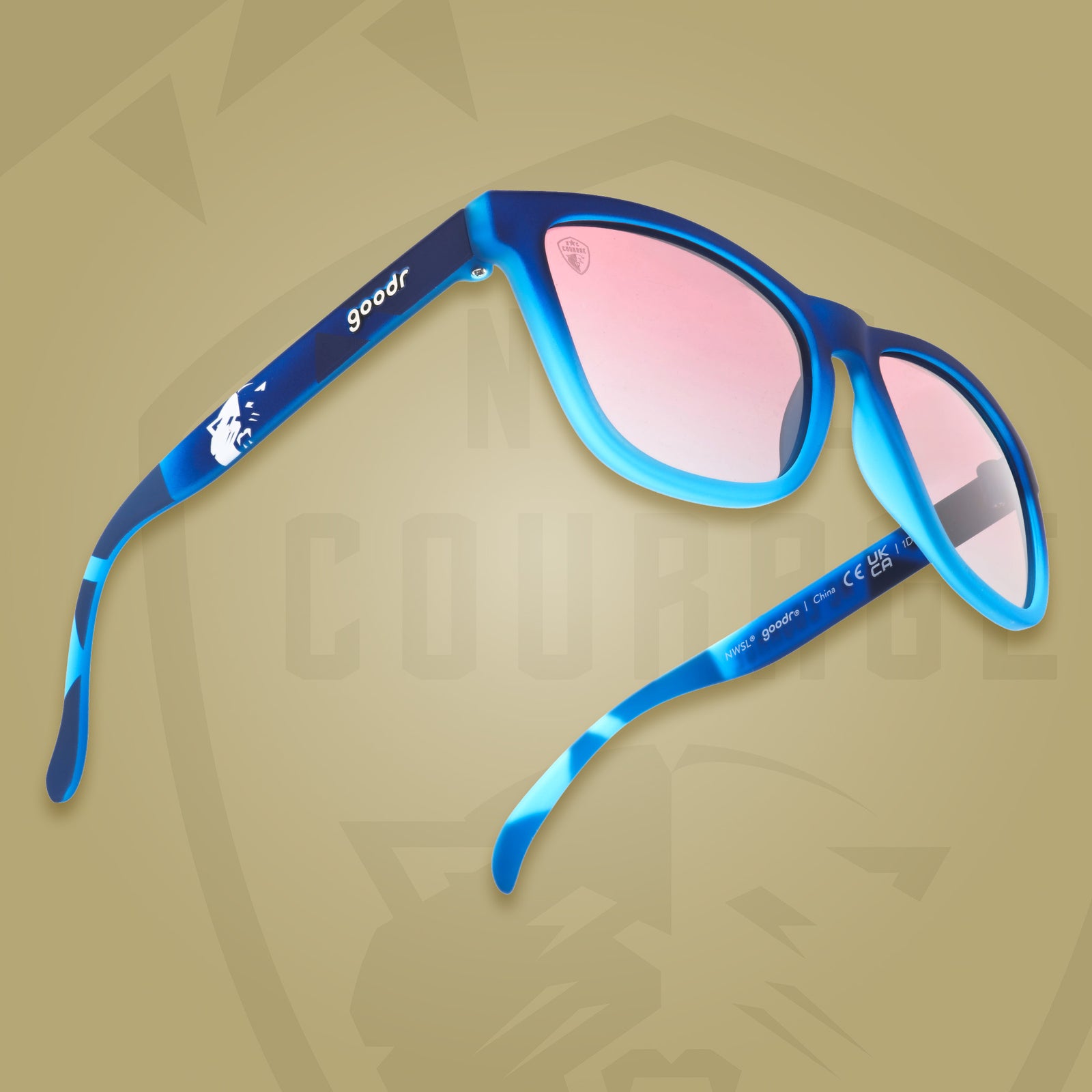Three-quarter angle view of  Atlantic blue frames with rose gradient lenses and the NC Courage Lioness logo.