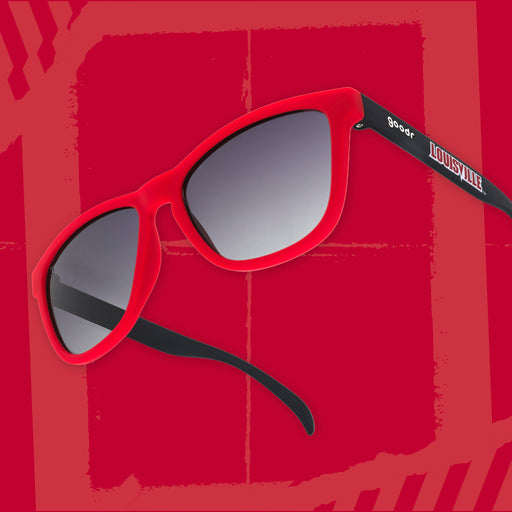 Right three-quarter angle view of black and Cardinal red sunglasses featuring black gradient lenses and a Louisville logo on a red background.