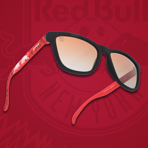 Three-quarter angle view of MLS New York Red Bulls shades. Red+black frames. Orange+gold gradient lenses.